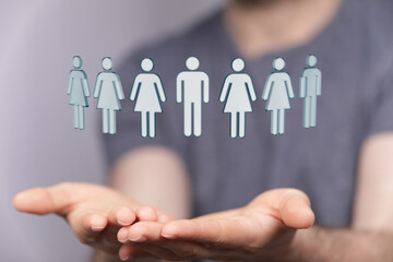 3D render of human figures hovering above open hands, symbolizing teamwork, support, and abstract concepts. Conceptual