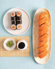 Maki and roll on the plates, top view © Uliana