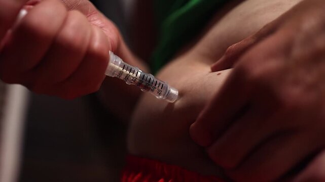 Close up: Semaglutide diabetes medication injected into belly fat, male