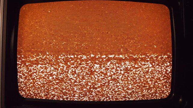 Vintage Television Screen with Orange Static and Noise.
