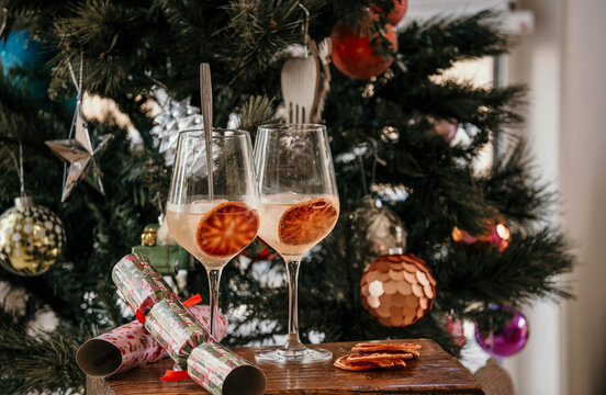 Pair of festive cocktails on table with bon bons