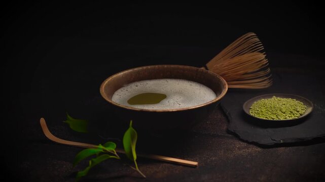 4k Matcha Tea Composition with tea powder, whisk amd bamboo spoon