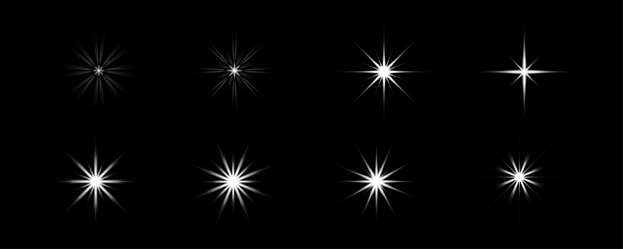 White Starburst Glow Light Effects Set Isolated on Black Background