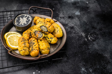 Crispy seaweed noodle rolls Gimmari, Korean deep fried seaweed rolls. black background. top view