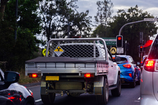 Covered load on ute amongst traffic on road