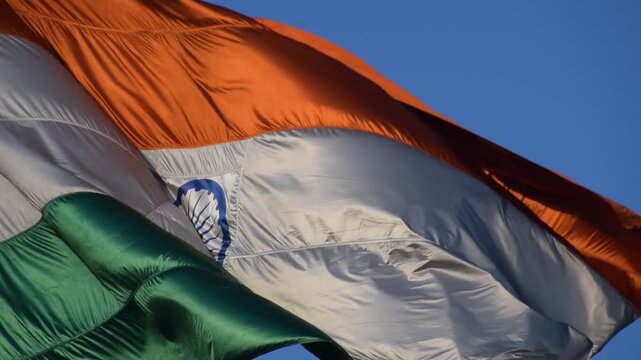 India flag flying high at Connaught Place with pride with plain white background, India flag fluttering, Indian Flag on Independence Day and Republic Day of India, tilt up shot, Har Ghar Tiranga