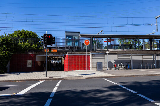 traffic lights at road intersection by train station platform in Sydney suburb