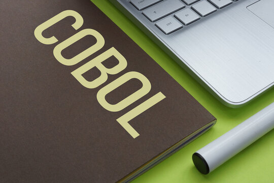 COBOL Common Business-Oriented Language programming concept, legacy system maintenance, mainframe technology, banking software development, outdated code and modernization challenge