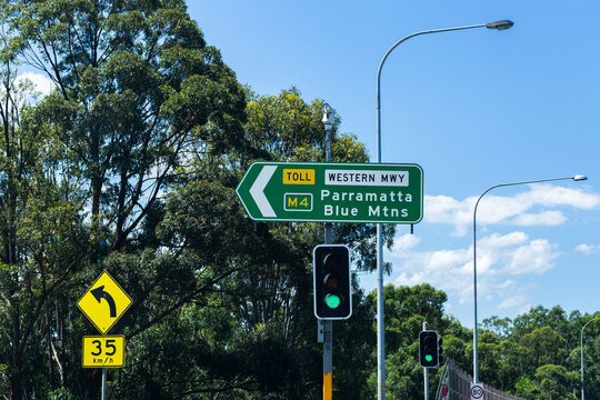 Sign at traffic lights to toll road western motorway M4