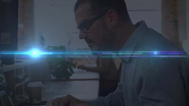 Summarize:the video features a man working at a desk in an office