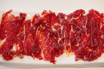 Obraz premium top view dish of tender beef at horizontal composition