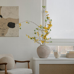 Vibrant Yellow Flowers in Textured Vase Enhance a Modern Minimalist Interior with Art and Natural...
