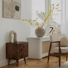 Cozy living room interior with modern furniture, natural light, and elegant decor, displaying...