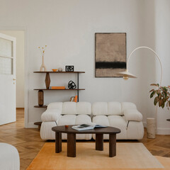 Minimalist living room interior design with white sofa, wooden furniture, and warm neutral tones...