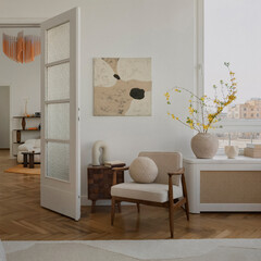 Minimalist Living Room Interior with Modern Art, Armchair, and Natural Light for Contemporary Home...