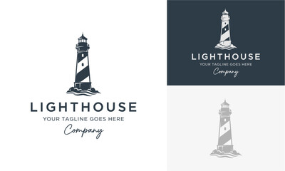 A majestic lighthouse stands tall on a rocky coastline viewed from a low angle, symbolizing guidance and safety in a serene environment