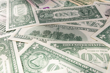 Scattered Pile of Various US Dollar Bills: 1, 5, 20, and 100 Denominations