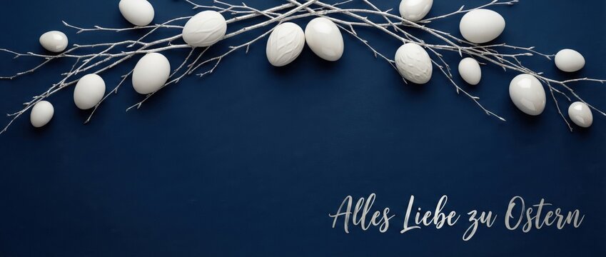 White Easter eggs on silver branches against dark blue background, festive holiday decoration with Alles Liebe zu Ostern text, concept of spring celebration and tradition