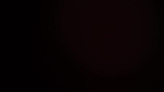 Warm organic film or sensor light leak with natural gradient shadow. Realistic abstract motion background ideal for cinematic transitions, overlays, titles and atmospheric horizontal editing.