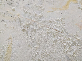 Fototapeta premium Surface of the wall has some paint peeling due to dampness.