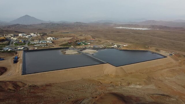 Aerial view of water reservoirs in peruvian desert landscape