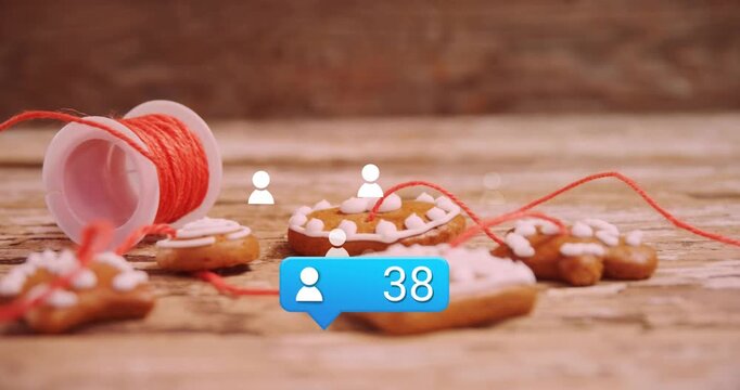 Animation of media icons over cookies at christmas