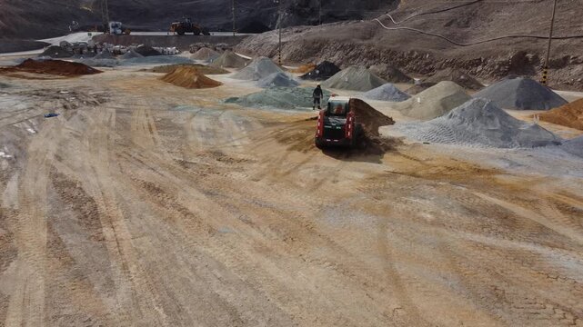 Skid steer loader working at quarry site