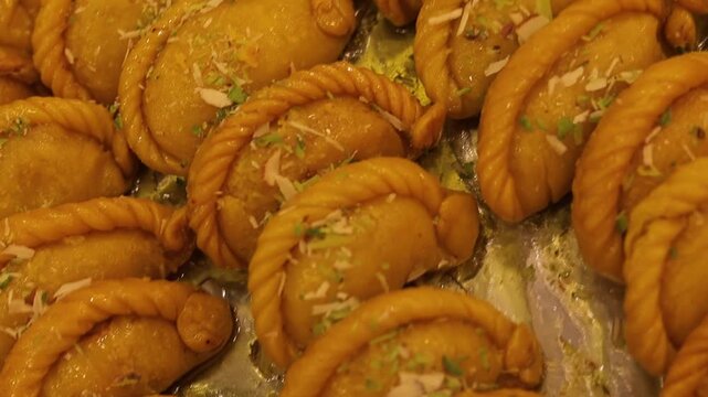Gujhiya indian holi dessert assorted on beautiful plating 