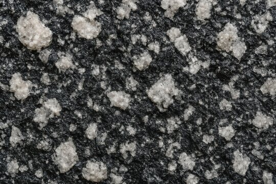 Natural diorite rock surface showing mottled black and white grain pattern