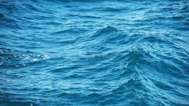 A mesmerizing view of the vast, undulating ocean with turquoise water, a symbol of endless beauty and strength. The image showcases the dynamic, ever-changing nature of the sea