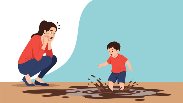 Shocked mother looking at her young son jumping into a messy mud puddle and splashing dirty water during playful outdoor activity.