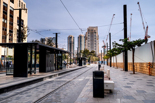 Tram stop with people on the main street in Israel's capital. Everyday life on streets Jerusalem, Israel.