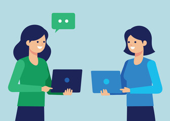 Fototapeta premium Two smiling businesswomen standing and holding laptops, with a chat bubble indicating communication.