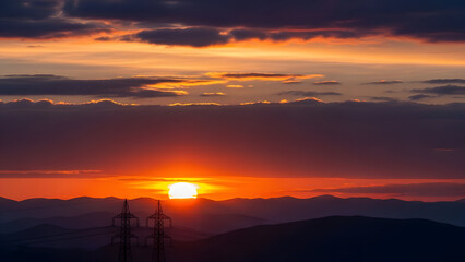Vibrant sunset over mountain range with scattered clouds