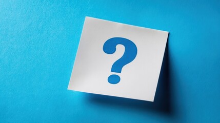 The Question Mark on a White Note Casting a Shadow on Blue Background