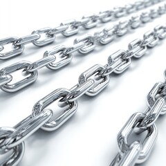 Obraz premium Close-up of multiple silver chains diagonally across a white surface, with a shallow depth of field