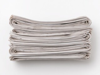 Stacked, folded pages of reading material, appearing as aged paper on a white background