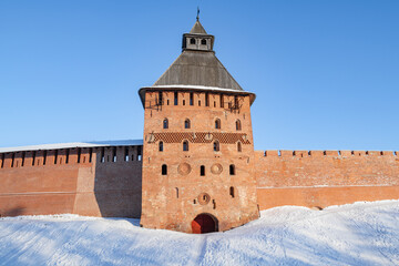 The ancient Spasskaya Tower of the Detinets (Kremlin) of Veliky Novgorod on a sunny February day. Russia
