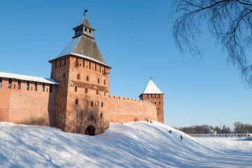 The ancient Spasskaya Tower of the Veliky Novgorod Kremlin in a cityscape on a February day. Russia