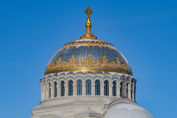 The dome of the Naval Cathedral of St. Nicholas the Wonderworker is close-up against the blue sky. Kronstadt, Russia