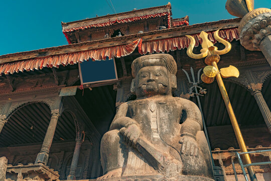 Ancient Stone Guardian Statue at Dattatreya Temple Nepal with Copy Space
