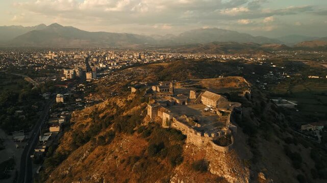 Aerial view of Rozafa Castle ruins at sunset, historic fortress on a hill in Shkoder, Albania