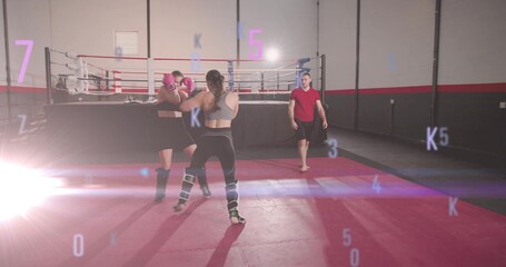 Sparring two fighters in athletic gear with coach walking toward raised ring at gym, lens flare