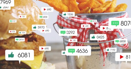 Featuring sesame-bun burger and gingham bucket of chips on wooden tabletop, with social overlays