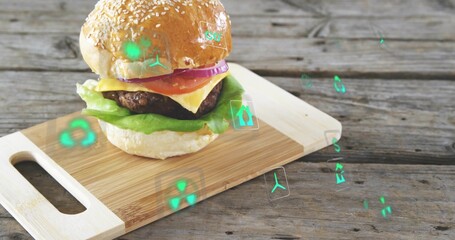 Fototapeta premium Displaying burger sitting on cutting board on weathered wood table, showing floating green AR icons