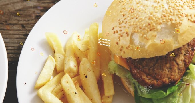 Displaying white plate with sesame-seed burger, peppered thick-cut fries on rustic table, overlays