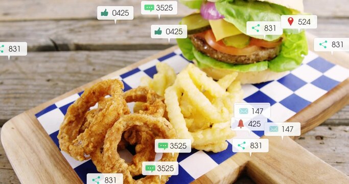 Showing burger, crinkle fries, onion rings on wooden board with blue-check liner, overlays