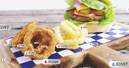 Displaying cheeseburger sitting on checkered paper on serving board, with fries and social overlays