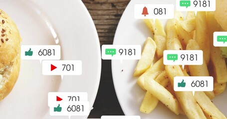 Displaying white plates holding seeded roll, seasoned fries on wooden table with icons and counters