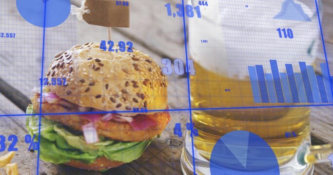 Showing seeded-bun burger with skewer and fried patty on wood table, with beer and blue overlay